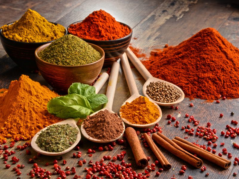 Variety of spices on kitchen table.